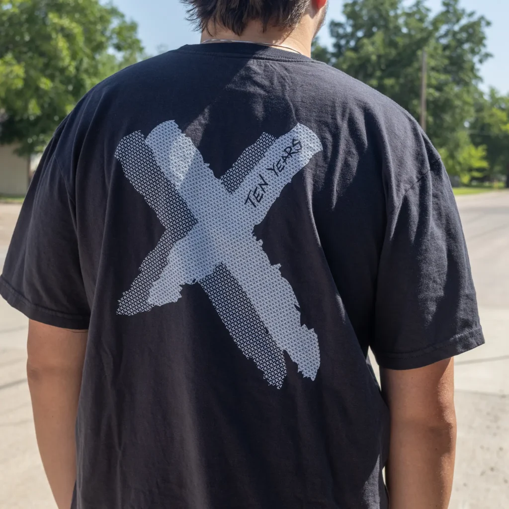 model wearing Rally 2 Give 10 year X t shirt